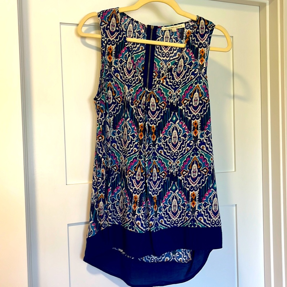Daniel Rainn V neck blouse with color-block hem line.